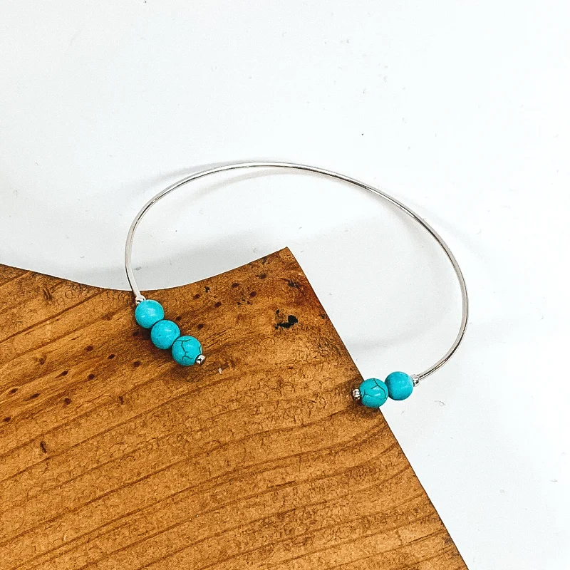 women’s chic bracelets-Thin Wire Bangle with Beaded Turquoise Ends in Silver Tone